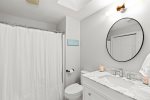 Full bathroom with a tub and shower